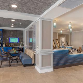 A modern lobby interior featuring comfortable seating and contemporary decor.