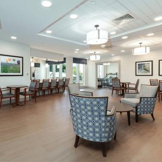 A spacious and modern dining area with elegant dcor and comfortable seating.