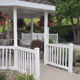 A peaceful gazebo in a garden setting, inviting relaxation amidst nature.
