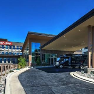 Entrance of a hotel under a clear blue sky.