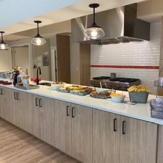A buffet setup on a kitchen counter with various food items.