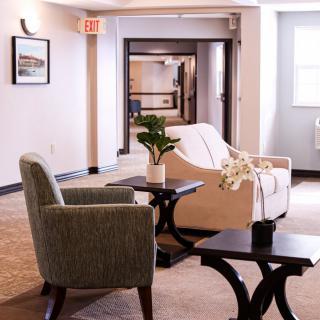 A cozy lobby seating area with comfortable chairs and stylish decor.