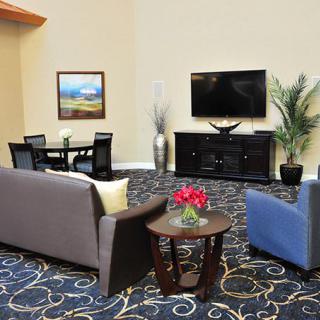 A cozy living room with modern furniture and decor.