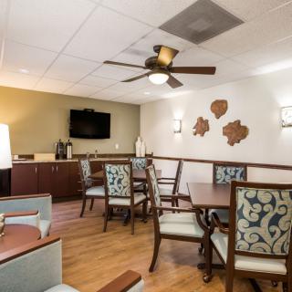 A cozy dining area with elegant furniture and warm lighting.