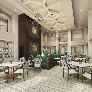 An elegant restaurant interior with luxurious decor and chandeliers.