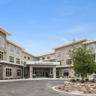 A modern building with a welcoming entrance and well-maintained landscaping.