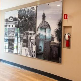 A wall display featuring historical architectural photographs in a modern interior setting.