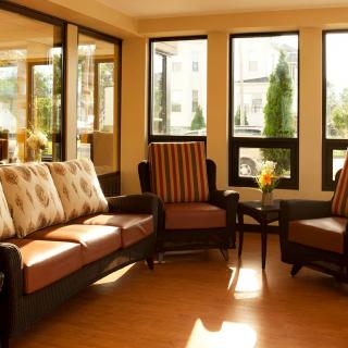 A cozy living room with comfortable seating and abundant natural light.