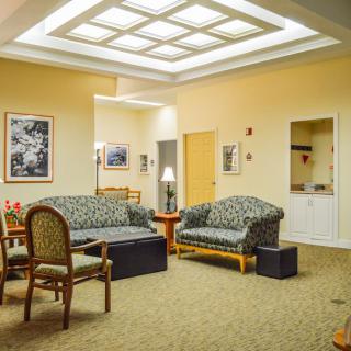 A cozy living room with comfortable seating and warm lighting.