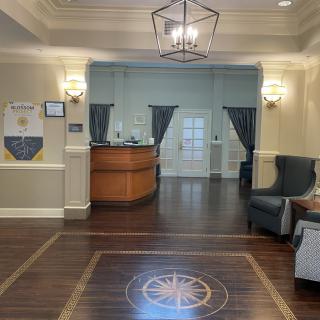 A welcoming reception area with elegant interior design and comfortable seating.