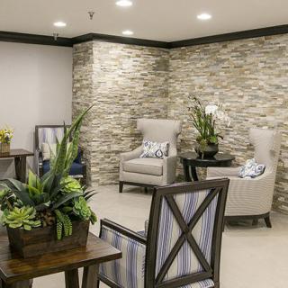 A modern lounge area with comfortable seating and decorative elements.