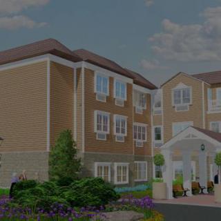 A modern residential building with landscaped surroundings.