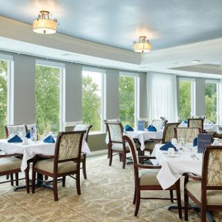 A beautifully arranged dining area with elegant decor and natural light.