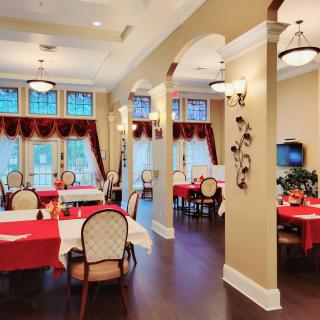 A charming restaurant interior with neatly arranged tables and elegant decor.