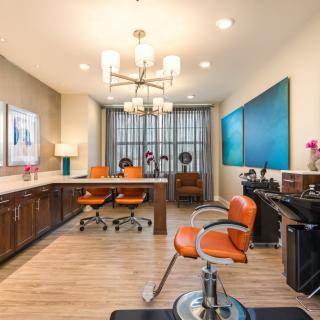 A modern office interior featuring sleek furniture and contemporary art.