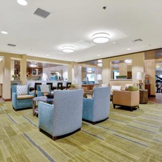 A spacious and modern lobby with comfortable seating and stylish decor.