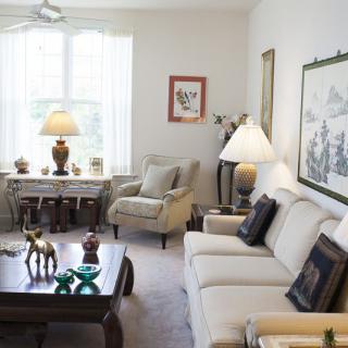 A cozy living room with comfortable seating and tasteful decorations.