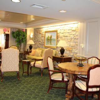 A cozy living area with elegant furniture and warm lighting.