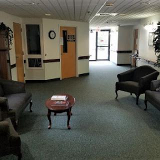 A spacious waiting area featuring comfortable seating and a welcoming atmosphere.