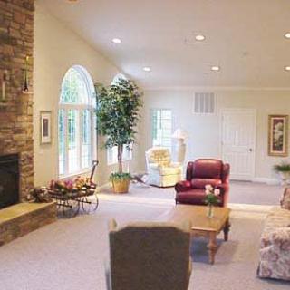 A cozy living room with a fireplace and comfortable seating.