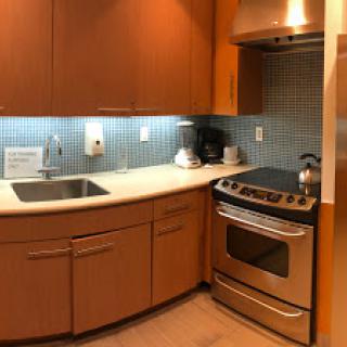 A modern kitchen featuring sleek cabinetry, stainless steel appliances, and a stylish countertop.