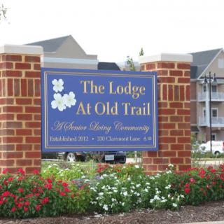 The entrance sign for The Lodge at Old Trail, a senior living community.