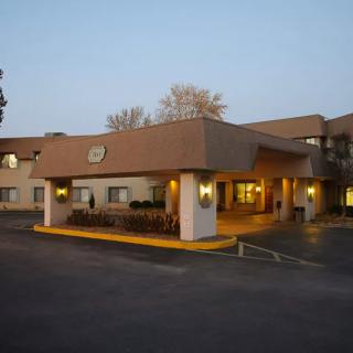 Exterior view of a hotel building in the evening.