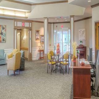A well-lit lobby with comfortable seating arrangements and tasteful decor.