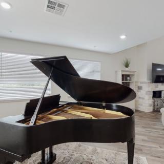 A grand piano in a modern living room setting.