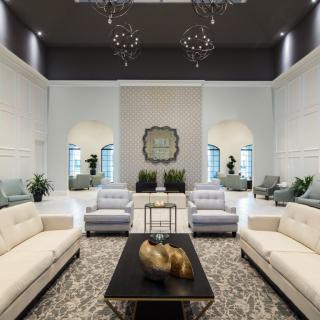 A luxurious and modern living room with elegant furniture and decor.