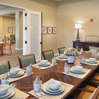 A beautifully set dining table in an elegant dining room.