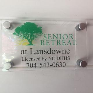 Sign for Senior Retreat at Lansdowne with contact details.