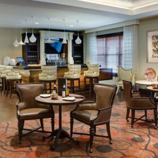 A cozy restaurant and bar area with comfortable seating and elegant decor.