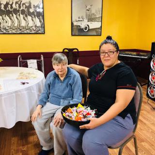 A warm moment shared between two friends, showcasing a beautiful arrangement of food.