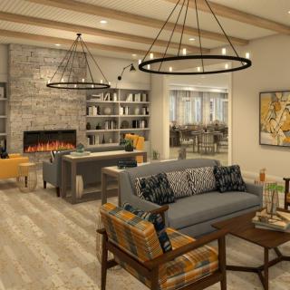 A modern living room with a cozy fireplace, stylish lighting fixtures, and comfortable seating.