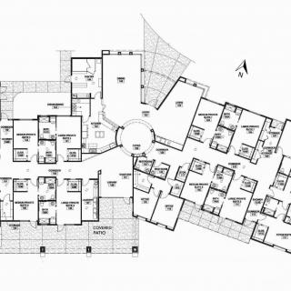 An architectural floor plan illustrating the layout of a building with multiple rooms and apartments.