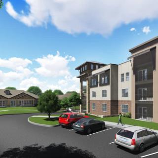 A modern residential building with a parking lot and cars, set against a partially cloudy sky.