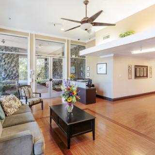 A modern and inviting living room with stylish furniture and ample natural light.