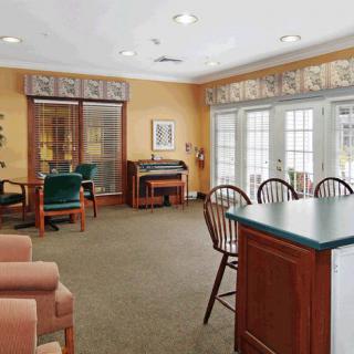A well-furnished living area with comfortable seating and ample natural light.