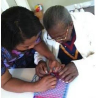Two people collaborating on a crafting project.