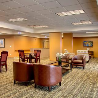 A stylish and comfortable lobby area with seating and tables.