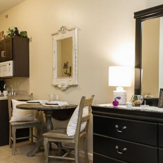 Cozy dining and kitchenette area with elegant furnishings.