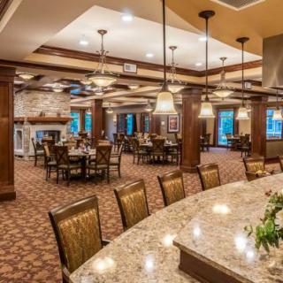 Elegant dining area with well-arranged tables and warm lighting.
