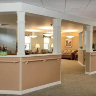 A well-lit lobby area with seating and decorative elements.