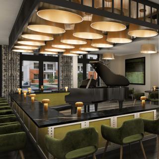 A modern restaurant interior featuring a grand piano, stylish seating, and warm lighting.