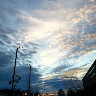 A beautiful blend of clouds and colors in the evening sky over the city.