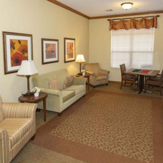 A cozy living room with comfortable seating and warm decor.