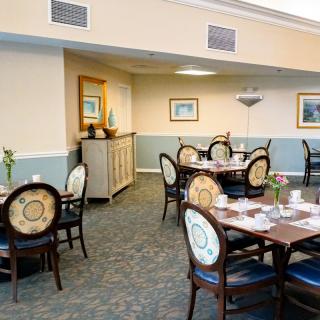 A well-decorated restaurant dining area with neatly arranged tables and chairs.