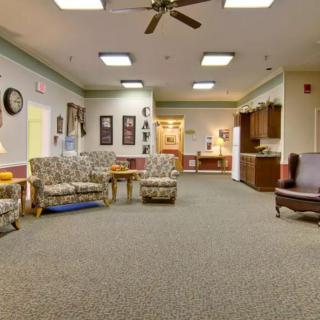A cozy waiting area with comfortable seating and warm lighting.