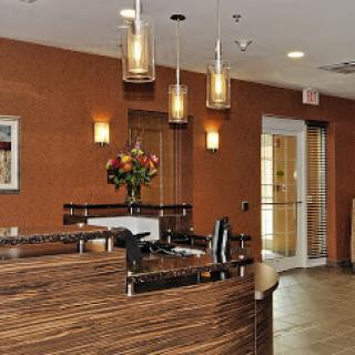 A welcoming modern reception area featuring stylish decor and lighting.